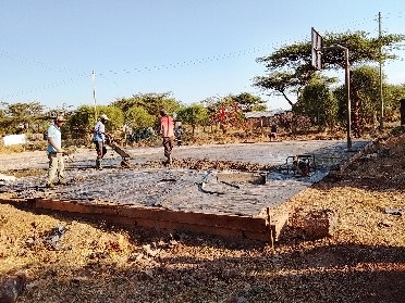 Members Constructing Basketball Pitch
